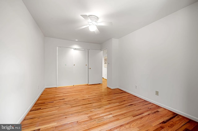 6128 Buckingham Manor Dr, Baltimore, MD 21210 - unfurnished bedroom with light wood-style floors, a closet, and ceiling fan
