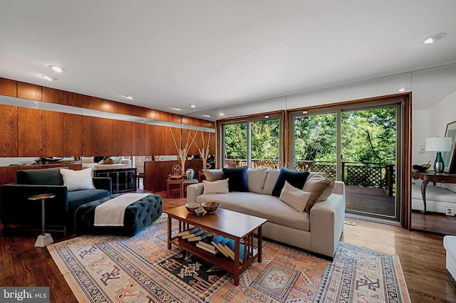 6128 Buckingham Manor Dr, Baltimore, MD 21210 - living room featuring wood walls, wood finished floors, and recessed lighting