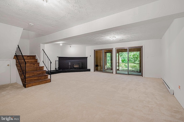6128 Buckingham Manor Dr, Baltimore, MD 21210 - unfurnished living room with baseboard heating, a textured ceiling, carpet floors, stairway, and a fireplace with raised hearth