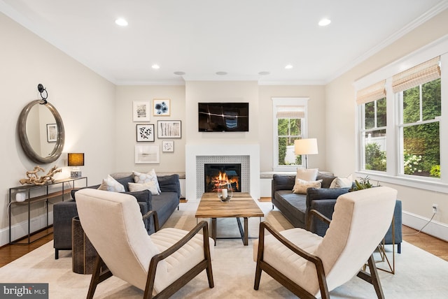 2407 N Nelson St, Arlington, VA 22207 - living room featuring ornamental molding, recessed lighting, a glass covered fireplace, and light wood-style flooring