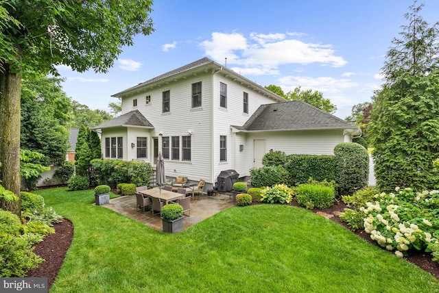 2407 N Nelson St, Arlington, VA 22207 - back of house featuring a patio, a yard, and a shingled roof