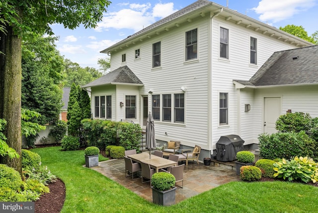 2407 N Nelson St, Arlington, VA 22207 - rear view of house featuring a lawn and a patio