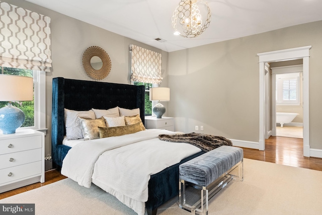 2407 N Nelson St, Arlington, VA 22207 - bedroom with wood finished floors and a chandelier
