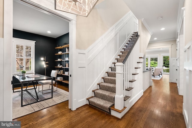 2407 N Nelson St, Arlington, VA 22207 - stairs with wood finished floors, ornamental molding, a decorative wall, and recessed lighting