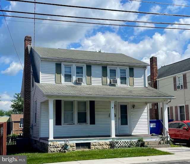 411 W Elm Ave, Hanover, PA 17331 - view of front of property with a porch, a chimney, and cooling unit