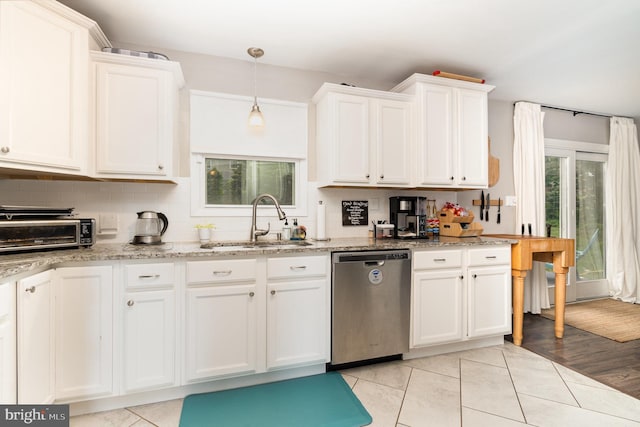 30 Bunker Ln, Etters, PA 17319 - kitchen with dishwasher, white cabinetry, light stone countertops, and backsplash