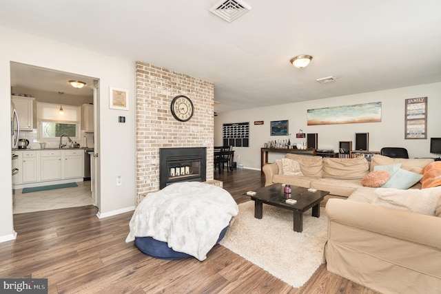 30 Bunker Ln, Etters, PA 17319 - living room featuring wood finished floors and a fireplace