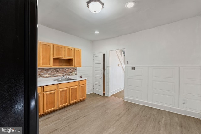 1245 Chase St, Camden, NJ 08104 - kitchen with light countertops, decorative backsplash, light wood-style flooring, recessed lighting, and open shelves