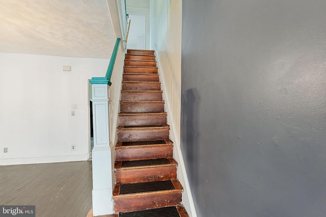 1245 Chase St, Camden, NJ 08104 - stairway with baseboards and wood finished floors