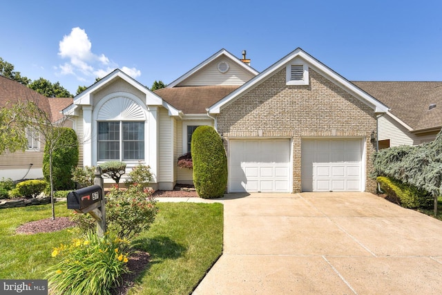 57 Harwood Rd, Monroe Township, NJ 08831 - view of front of home featuring a garage, concrete driveway, brick siding, a shingled roof, and a front yard