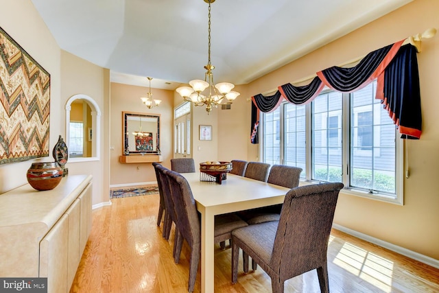 57 Harwood Rd, Monroe Township, NJ 08831 - dining space with light wood-style flooring and a chandelier
