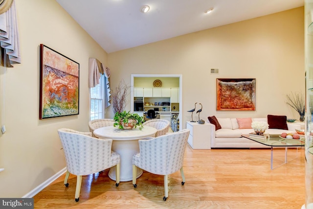 57 Harwood Rd, Monroe Township, NJ 08831 - dining space featuring lofted ceiling and wood finished floors