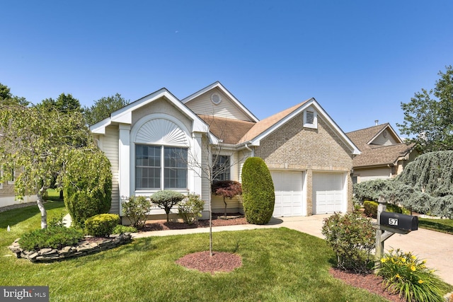 57 Harwood Rd, Monroe Township, NJ 08831 - view of front of property featuring driveway, a garage, and a front lawn
