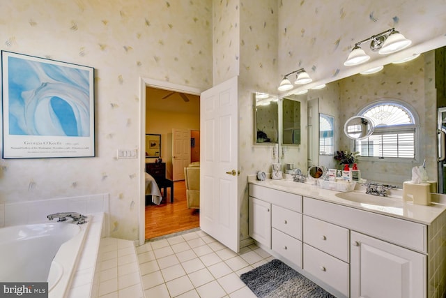 57 Harwood Rd, Monroe Township, NJ 08831 - full bathroom with wallpapered walls, connected bathroom, double vanity, tile patterned flooring, and a garden tub