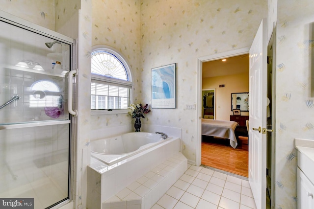 57 Harwood Rd, Monroe Township, NJ 08831 - ensuite bathroom with a garden tub, wallpapered walls, tile patterned floors, a shower stall, and vanity