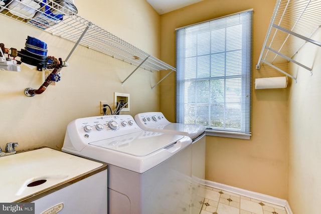 57 Harwood Rd, Monroe Township, NJ 08831 - washroom with washing machine and clothes dryer and baseboards