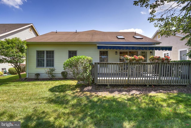 57 Harwood Rd, Monroe Township, NJ 08831 - rear view of house featuring a deck and a lawn
