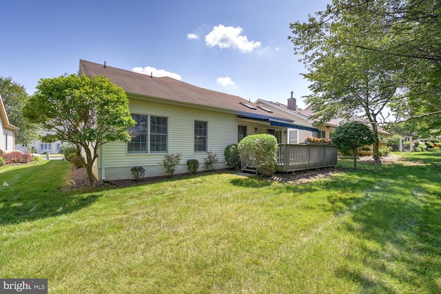 57 Harwood Rd, Monroe Township, NJ 08831 - back of property featuring a wooden deck and a lawn