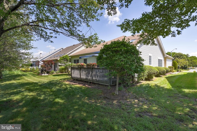 57 Harwood Rd, Monroe Township, NJ 08831 - view of green lawn featuring a deck