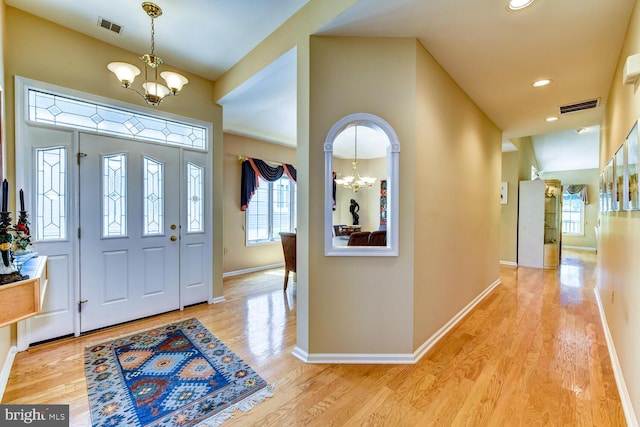 57 Harwood Rd, Monroe Township, NJ 08831 - entryway with a chandelier, plenty of natural light, light wood-type flooring, and recessed lighting