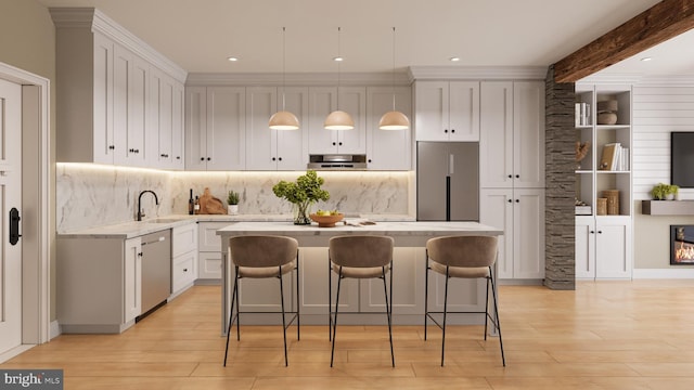 449 Greenridge Rd, Glenmoore, PA 19343 - kitchen with dishwasher, built in refrigerator, range hood, a kitchen island, and a breakfast bar