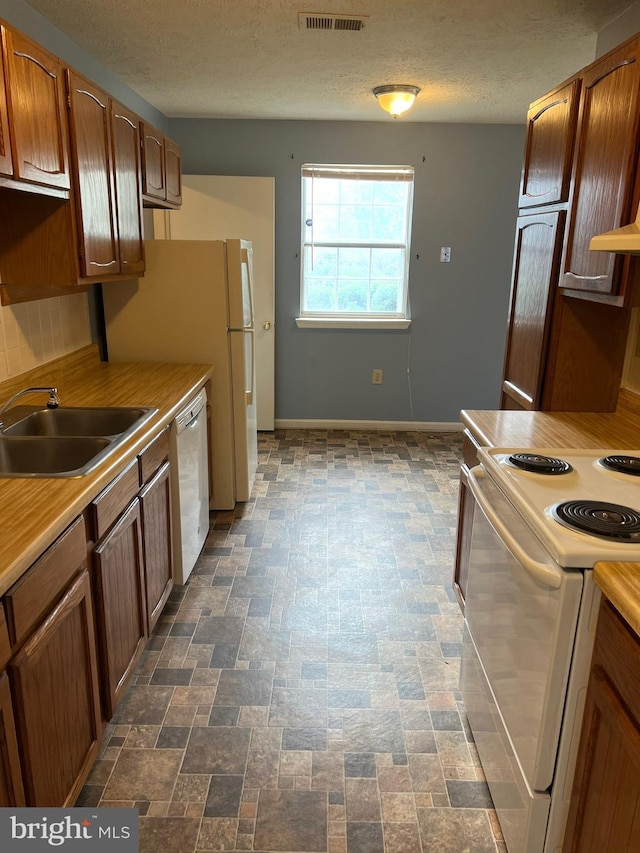 2177 Fawn Ct, Waldorf, MD 20602 - kitchen with white appliances, light countertops, and a textured ceiling