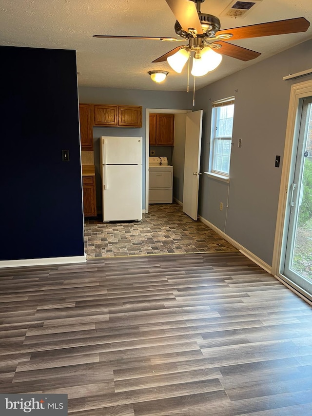 2177 Fawn Ct, Waldorf, MD 20602 - kitchen featuring freestanding refrigerator, brown cabinetry, ceiling fan, and wood finished floors