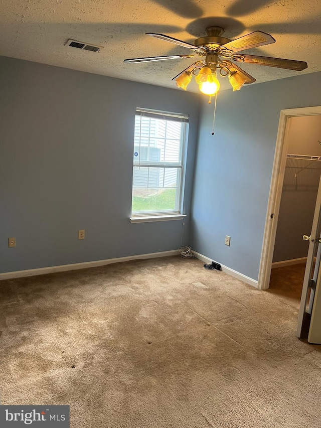 2177 Fawn Ct, Waldorf, MD 20602 - unfurnished room featuring ceiling fan, carpet floors, and a textured ceiling