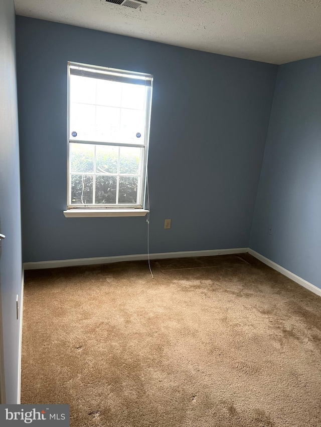 2177 Fawn Ct, Waldorf, MD 20602 - carpeted empty room with baseboards and a textured ceiling