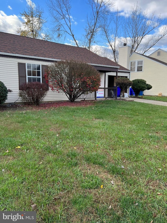 2177 Fawn Ct, Waldorf, MD 20602 - rear view of house with a lawn and roof with shingles
