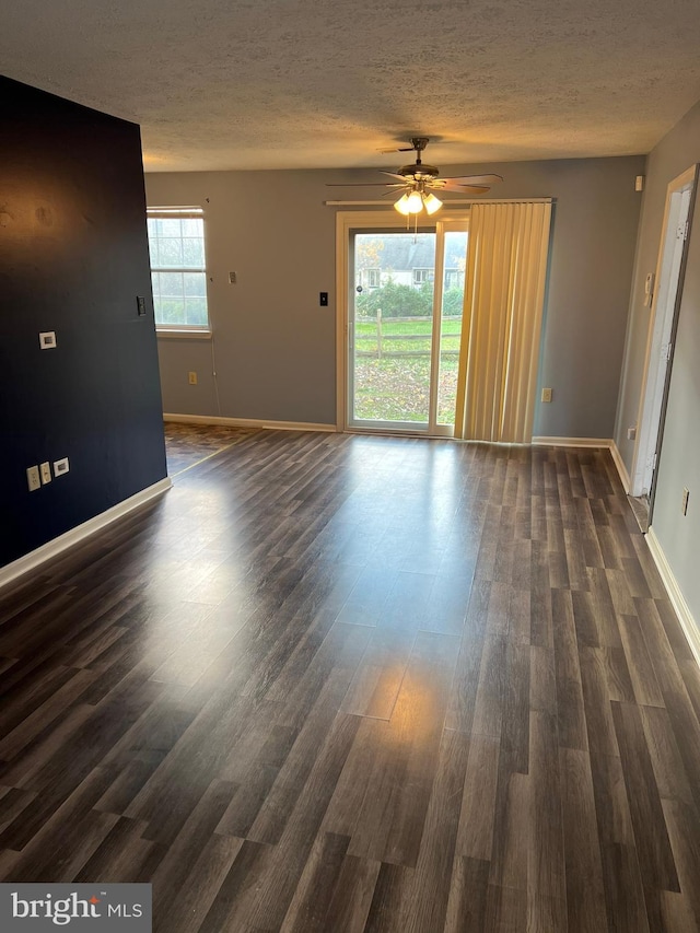 2177 Fawn Ct, Waldorf, MD 20602 - empty room with a textured ceiling, dark wood-style flooring, and a ceiling fan