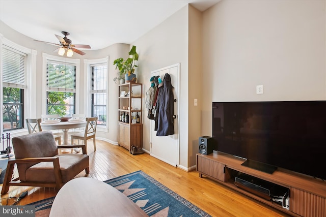 2117 N St NW Unit 2, Washington, DC 20037 - living area featuring light wood finished floors and a ceiling fan