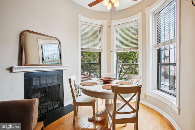 2117 N St NW Unit 2, Washington, DC 20037 - dining space with hardwood / wood-style flooring, a fireplace with flush hearth, and ceiling fan