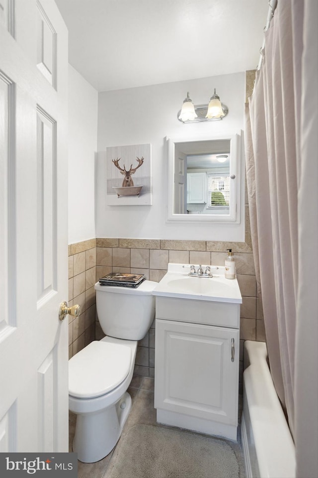 53 Ackerman Ave, Saddle Brook, NJ 07663 - bathroom featuring tile walls, vanity, a wainscoted wall, and shower / bath combo