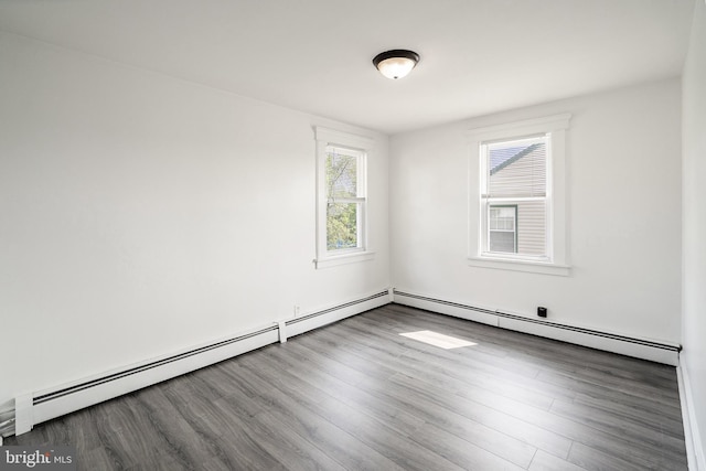 53 Ackerman Ave, Saddle Brook, NJ 07663 - spare room with a baseboard radiator and wood finished floors