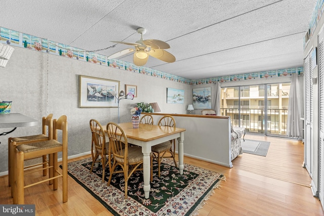 4709 Coastal Hwy Unit 460, Ocean City, MD 21842 - dining room with wood finished floors, ceiling fan, and a textured ceiling