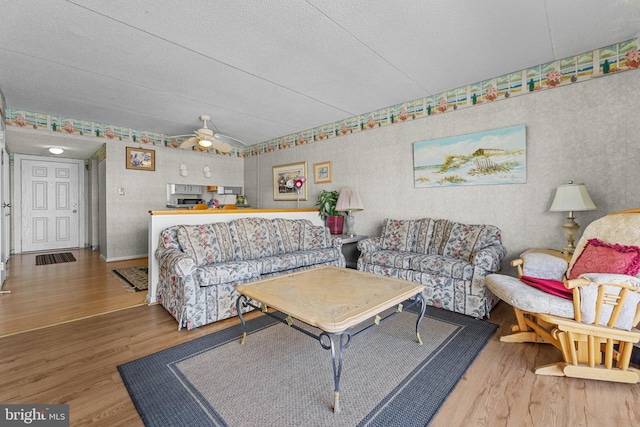 4709 Coastal Hwy Unit 460, Ocean City, MD 21842 - living room featuring wood finished floors, a textured ceiling, ceiling fan, and vaulted ceiling