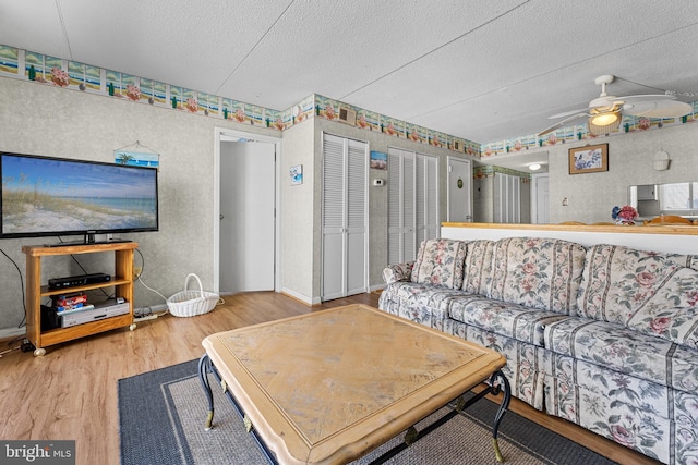 4709 Coastal Hwy Unit 460, Ocean City, MD 21842 - living room with wood finished floors, a textured ceiling, and a ceiling fan