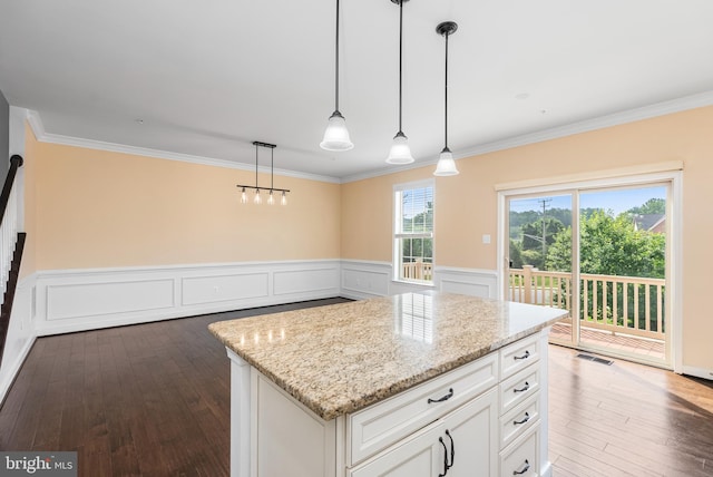 9 Fila Way, Sparks Glencoe, MD 21152 - kitchen featuring crown molding, light stone counters, hardwood / wood-style floors, white cabinetry, and a wainscoted wall
