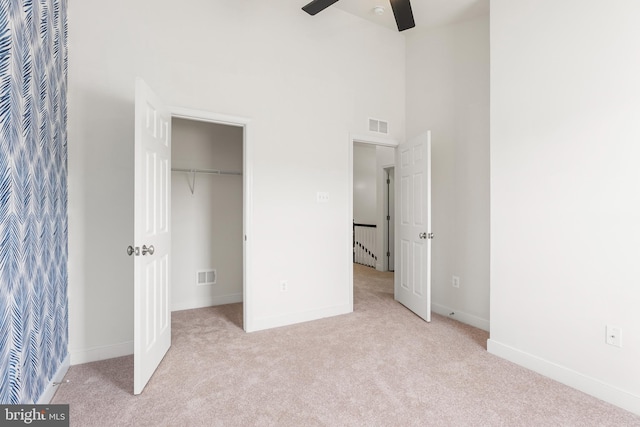 9 Fila Way, Sparks Glencoe, MD 21152 - unfurnished bedroom featuring light carpet, a towering ceiling, a closet, a spacious closet, and ceiling fan
