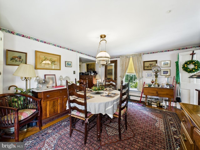 12194 Knife Box Rd, Greensboro, MD 21639 - dining space featuring baseboard heating and a chandelier