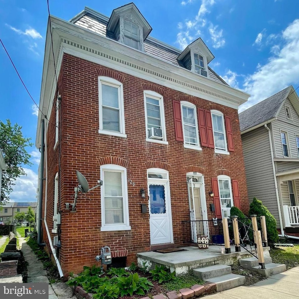 129 S Pleasant St, Hanover, PA 17331 - view of front of home featuring brick siding and cooling unit