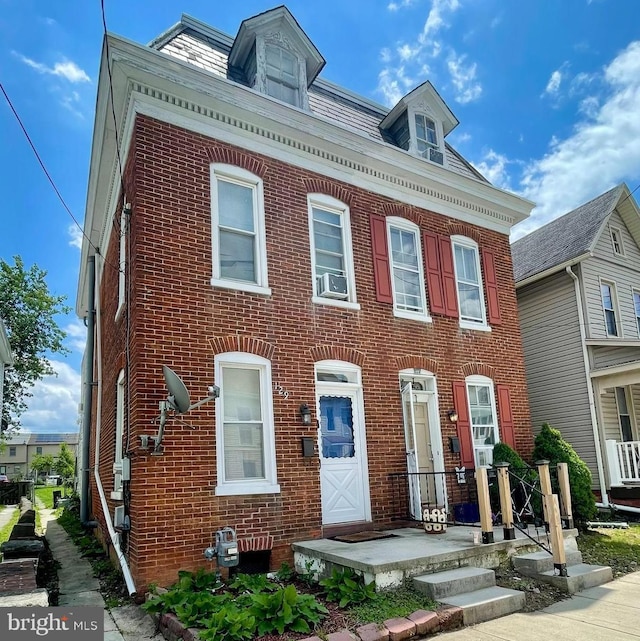 129 S Pleasant St, Hanover, PA 17331 - view of front of home featuring brick siding and cooling unit