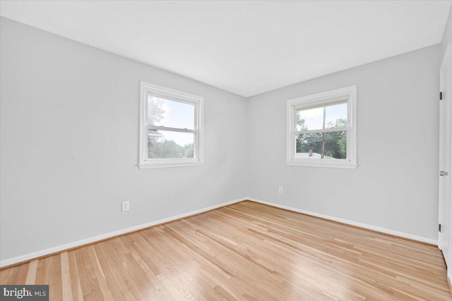 12329 La Plata St, Silver Spring, MD 20904 - unfurnished room with plenty of natural light and wood finished floors