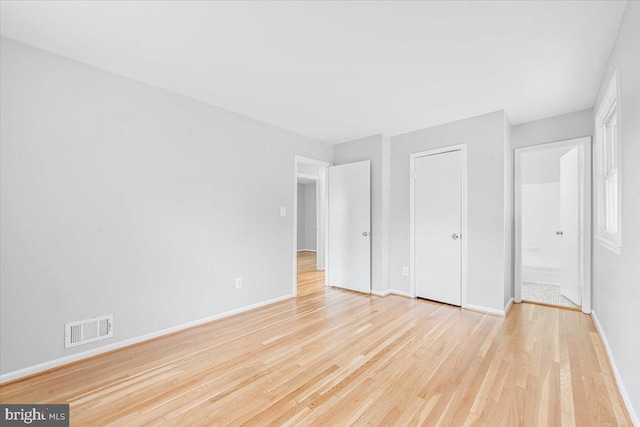 12329 La Plata St, Silver Spring, MD 20904 - unfurnished bedroom with light wood finished floors and ensuite bathroom