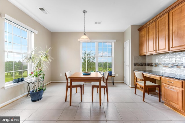 7315 Brookview Rd Unit 306, Elkridge, MD 21075 - dining room featuring plenty of natural light, a desk, and light tile patterned floors