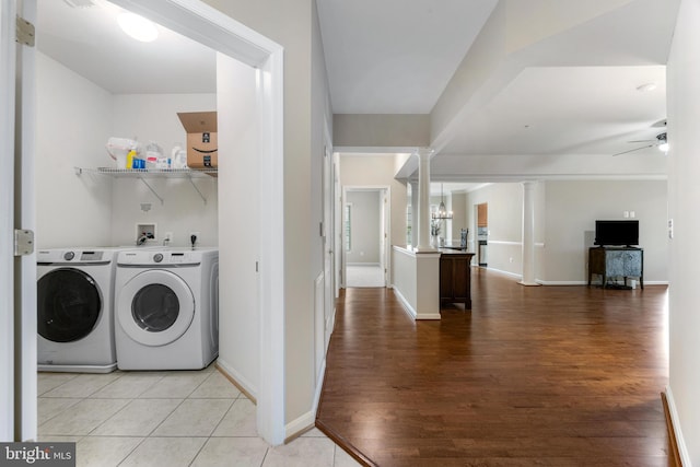7315 Brookview Rd Unit 306, Elkridge, MD 21075 - laundry area with washer and dryer, light wood-style floors, decorative columns, and ceiling fan