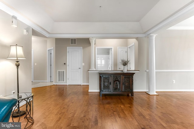 7315 Brookview Rd Unit 306, Elkridge, MD 21075 - unfurnished living room with decorative columns, a raised ceiling, and wood finished floors