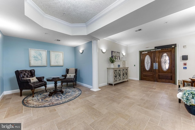 7315 Brookview Rd Unit 306, Elkridge, MD 21075 - foyer entrance with ornate columns, crown molding, and a tray ceiling