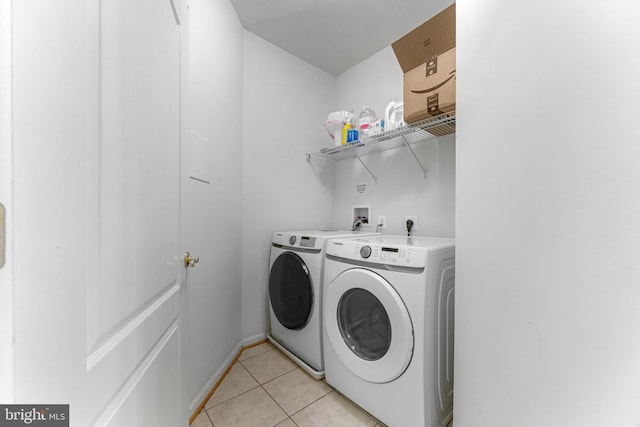 7315 Brookview Rd Unit 306, Elkridge, MD 21075 - laundry room with independent washer and dryer and light tile patterned floors
